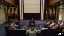 Myanmar's State Counsellor Aung San Suu Kyi (C) holds talks with leaders from the United Nationalities Federal Council (UNFC) at the National Reconciliation and Peace Centre (NRPC) in Yangon on July 17, 2016.