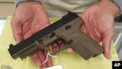 A Belgian-made FN semi-automatic pistol, that can only be purchased in California by law enforcement officers, is displayed for a photo at TDS Guns in Rocklin, California, Nov. 8, 2011.