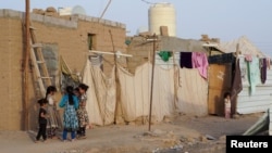 Girls play at a makeshift camp for internally displaced people (IDPs) in the oil-producing Marib province, Yemen May 10, 2021.
