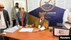 Seif al-Islam Gaddafi, son of Libya's former leader Moammar Gadhafi, registers as a presidential candidate for the December 24 election, at the registration center in the southern town of Sebha, Nov. 14, 2021. 