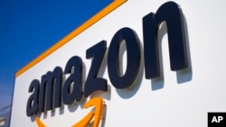 FILE - In this Thursday April 16, 2020 file photo, The Amazon logo is seen in Douai, northern France. 