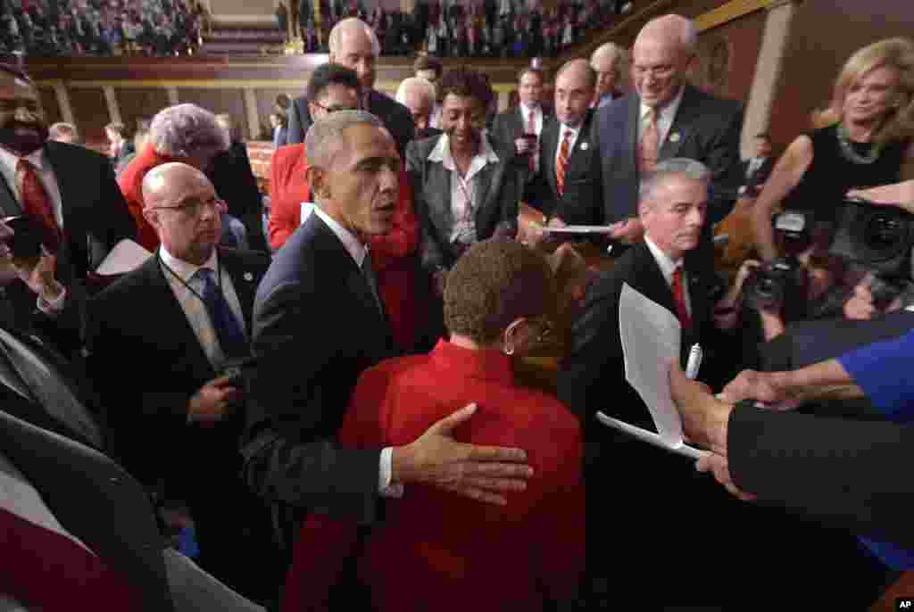 President Barack Obama greets members of Congress after delivering his State of the Union address, Jan. 20, 2015.