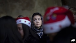 A Christian pilgrim lines up to go inside the Grotto, at the Church of Nativity, believed by many to be the birthplace of Jesus Christ, in the West Bank town of Bethlehem, Dec. 24, 2011.