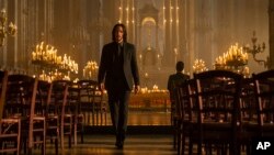 This image released by Lionsgate shows Keanu Reeves as John Wick in a scene from "John Wick 4." (Murray Close/Lionsgate via AP)