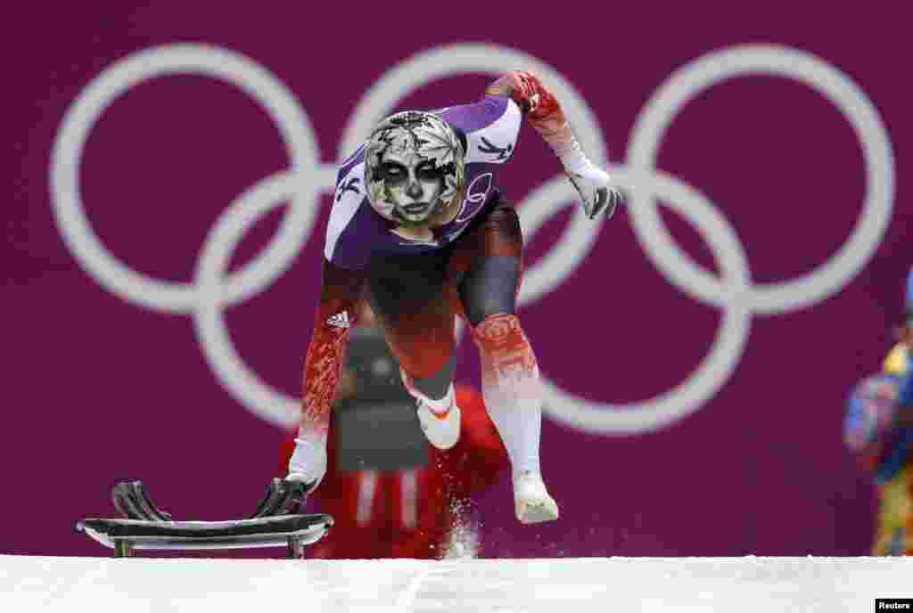 Canada&#39;s Sarah Reid starts in a women&#39;s skeleton training session during the 2014 Sochi Winter Olympic Games at the Sanki Sliding Center in Rosa Khutor in Russia.