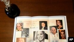 FILE - This photo shows a church program for a funeral Mass for eight of the 20 people killed in a fatal limousine crash in Schoharie, NY, during a memorial service at St. Stanislaus Roman Catholic Church in Amsterdam, NY, Oct. 13, 2018.