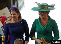 Princess Beatrice of York and Sarah, Duchess of York arrive at the wedding of Princess Eugenie to Jack Brooksbank at St George's Chapel in Windsor Castle, Britain, Oct.12, 2018.