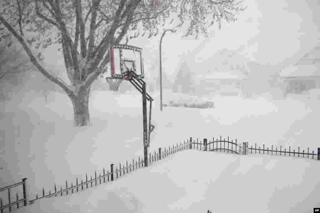 Parts of New York are measuring the season's first big snowfall in feet, rather than inches, as nearly 3 feet blanketed the Buffalo area, forcing the closure of a 105-mile stretch of the state Thruway.