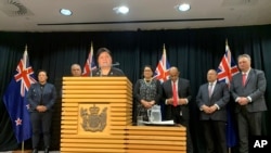 FILE - New Zealand's Foreign Minister Nanaia Mahuta, with senior lawmakers looking on, talks to reporters, in Wellington, New Zealand, Nov. 2, 2020.