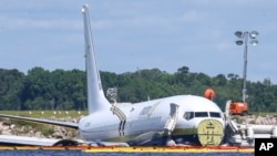A Boeing 737 arriving, May 3, 2019, at Naval Air Station Jacksonville from Naval Station Guantanamo Bay, Cuba, with 136 passengers and seven aircrew slid off the runway Friday night into the St. Johns River, a NAS Jacksonville news release said.