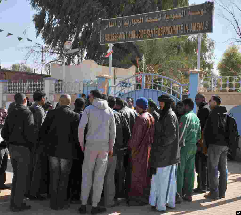 Residents of Ain Amenas, Algeria, gather outside the hospital trying to get information concerning relatives wounded during the terrorist attack at the gas plant, Friday, Jan. 18, 2013.&nbsp;
