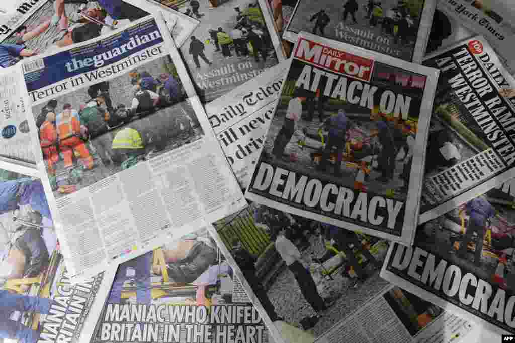 An arrangement of newspapers pictured in London on March 23, 2017, as an illustration, shows the front pages of the UK daily newspapers reporting on the March 22 terror attack.