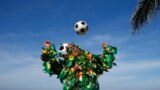 A Brazilian football fan plays with a soccer ball on a beach in Rio de Janeiro. The 2014 World Cup starts in Brazil on June 12, 2014.