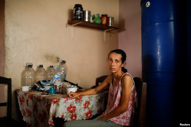 Yaneidi Guzman, 38, poses for a picture at her home in Caracas, Venezuela, Feb. 17, 2019. Guzman has lost a third of her weight over the past three years as Venezuela's economic collapse made food unaffordable.
