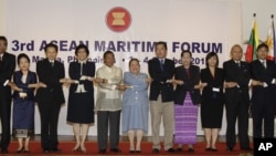 Philippine Vice President Jejomar Binay, 7th from left, joins hands with Association of Southeast Asian Nations (ASEAN) officials at the opening of the 3rd ASEAN Maritime Forum in Manila, Philippines, Oct. 3, 2012. 