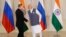 Indian Prime Minister Narendra Modi, right, shakes hand with Russian President Vladimir Putin prior to their bilateral meeting, in Goa, India, Oct. 15, 2016. The two leaders signed several agreements as part of apparent efforts aimed at rejuvenating ties.