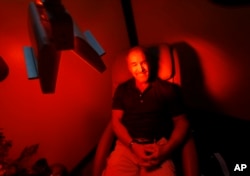 Ric Rooney sits in a newly installed room in his updated tanning salon northeast of downtown Colorado Springs, Colo., March 22, 2017. Former President Barack Obama's Affordable Care Act imposed a 10 percent tax on tanning as a way to help fund provisions of the law that expanded coverage for 20 million Americans.