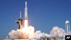 A SpaceX Falcon Heavy rocket with a NASA spacecraft bound for Jupiter lifts off from pad 39A at the Kennedy Space Center, Oct. 14, 2024 in Cape Canaveral, Florida. 