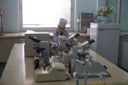 FILE - A nurse sits inside a laboratory as guests tour the Pyongyang Maternity Hospital in Pyongyang, North Korea, Feb. 20, 2013.