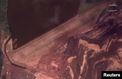 The dam at Vale's Corrego do Feijao mine near Brumadinho, Brazil, is pictured after it's Jan. 25, 2019 collapse in this Jan. 26, 2019 handout satellite photo.