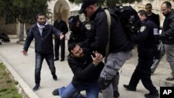 Israeli police arrests a Palestinian at al Aqsa mosque compound in Jerusalem, Feb. 18, 2019. 