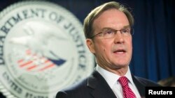 FILE - Michigan Attorney General Bill Schuette is pictured giving a speech in Boston, Dec. 17, 2014. He has begun a probe of the Larry Nassar sexual abuse scandal.