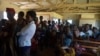 FILE - Mothers queue to have their children vaccinated against malaria at Likuni Community Hospital in Lilongwe, Malawi.