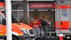 Paramedics work at the University Hospital in Duesseldorf, Germany, where a man who tested positive for the coronavirus is being treated, Feb. 26, 2020.