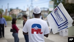 A man wears a shirt in support of Puerto Rican statehood before a campaign stop by Republican presidential candidate, former Massachusetts governor Mitt Romney on Saturday, March 17, 2012, in Bayamon, Puerto Rico.