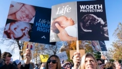 Anti-abortion protesters demonstrate in front of the U.S. Supreme Court, Dec. 1, 2021, in Washington.