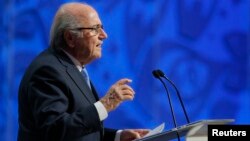 FILE - Former FIFA President Sepp Blatter addresses during the preliminary draw for the 2018 FIFA World Cup at Konstantin Palace in St. Petersburg, Russia July 25, 2015.