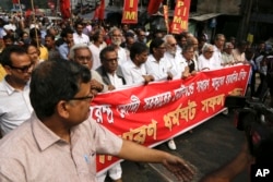 Left Front leaders take out a protest march against the government's decision to withdraw high denomination notes from circulation, in Kolkata, Nov. 28, 2016.