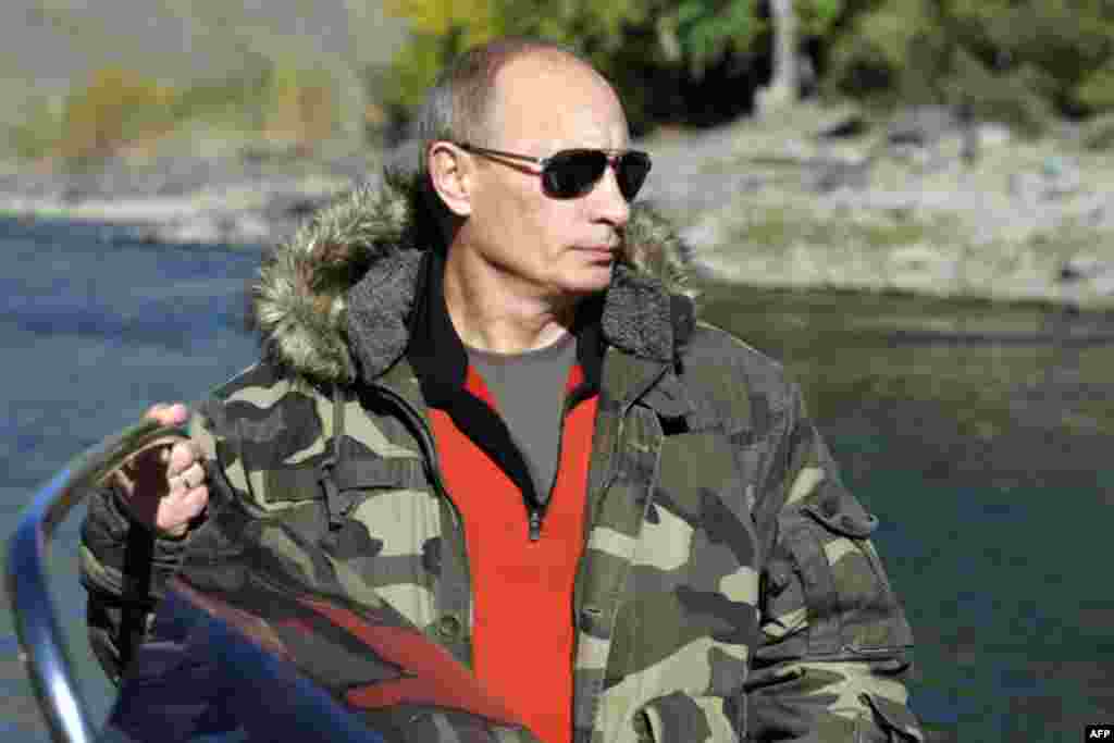 The image collections on the Russian government site, premier.gov.ru, feature dozens of photos of the president in camoflauge, captioned as "Vladimir Putin's nature reserve trips."