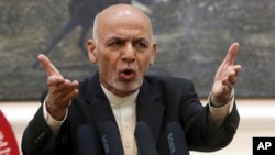 Afghan President Ashraf Ghani, speaks during, a press conference at the presidential palace in Kabul, Afghanistan.