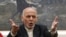 FILE - Afghan President Ashraf Ghani, speaks during, a press conference at the presidential palace in Kabul, Afghanistan.