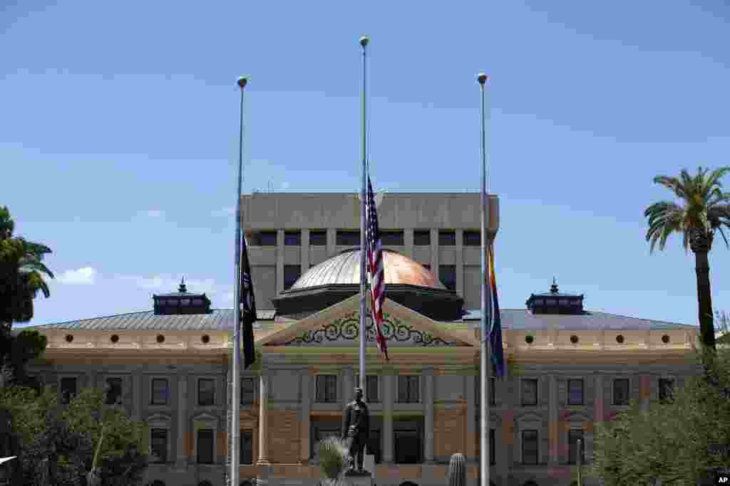 Flags fly at half-staff at the Arizona Capitol in memory of the late Arizona Republican Sen. John McCain, Aug. 26, 2018, in Phoenix. 