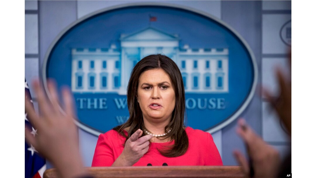 White House press secretary Sarah Huckabee Sanders calls on a member of the media during the daily press briefing at the White House, July 18, 2018, in Washington.