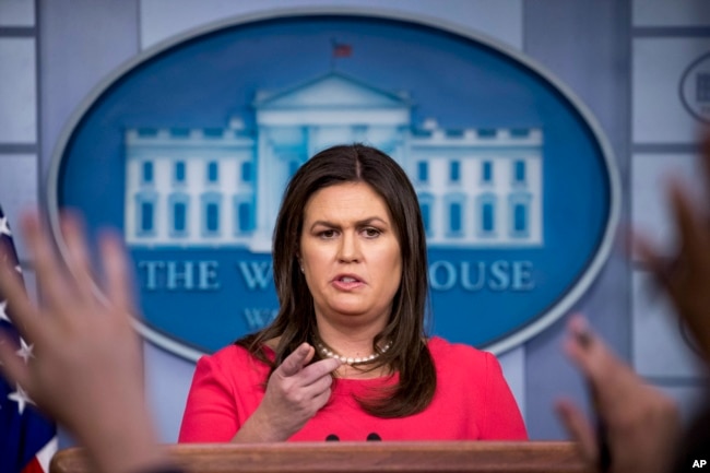 FILE - White House press secretary Sarah Huckabee Sanders calls on a member of the media during the daily press briefing at the White House, July 18, 2018, in Washington.