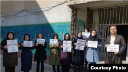 Iranian teachers join a nationwide teachers’ strike in the northwestern city of Marivan, March 4, 2019. They held protest signs calling for the release of detained teachers’ rights activists and for better working conditions. (Photo courtesy of CCTSI)