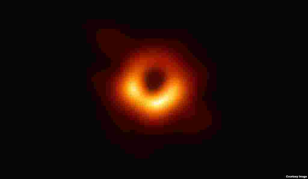 An image of the black hole at the center of Messier 87, a massive galaxy in the nearby Virgo galaxy cluster. This black hole resides 55 million light-years from Earth and has a mass 6.5-billion times that of the Sun.