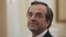 Newly appointed Greek Prime Minister Antonis Samaras smiles before a swearing in ceremony at the presidential palace in Athens, June 20, 2012. 
