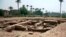This undated photo released by the Egyptian Ministry of Antiquities, shows a large Roman bath and a chamber likely for religious rituals, that was recently discovered in the town of Mit Rahina, 20 kilometers, or 12 miles, south of Cairo, Egypt. 