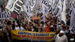 Supporters of Hafiz Saeed, the leader of a banned Islamic group Jamaat-ud-Dawa, an alias of the Lashkar -e-Taiba terror group, rally against India and United States in Lahore, Pakistan in this Feb. 26, 2011 file photo.