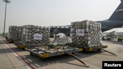 COVID-19 relief supplies from the U.S. are seen on the tarmac after being unloaded from a U.S. Air Force aircraft at the Indira Gandhi International Airport cargo terminal in New Delhi, India April 30, 2021.