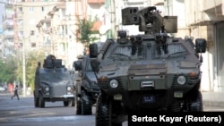 FILE - Members of Turkish police special forces take part in a security operation in Diyarbakir, Turkey, Oct. 26, 2015.