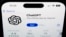 FILE -A ChapGPT logo is seen on a smartphone in West Chester, Pa., December 6, 2023. The World Economic Forum says false and misleading information supercharged with cutting-edge artificial intelligence is the top immediate risk to the global economy.