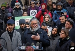 FILE - Ravi Ragbir (C), a citizen of Trinidad and Tobago and executive director of the New Sanctuary Coalition of New York City, speaks during a press conference held on his behalf as he fights deportation, Jan. 31, 2018, at New York City Hall.