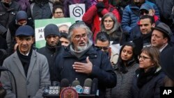 FILE - Ravi Ragbir (C), a citizen of Trinidad and Tobago and executive director of the New Sanctuary Coalition of New York City, speaks during a press conference held on his behalf as he fights deportation, Jan. 31, 2018, at New York City Hall. 