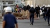 Riot police make their way towards anti-government protesters attempting to stage a rally in Budaiya, west of Manama, Bahrain's capital, May 17, 2013.