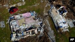 A house lays shattered, destroyed by Hurricane Dorian, in High Rock, Grand Bahama, Bahamas, Friday Sept. 6, 2019. 